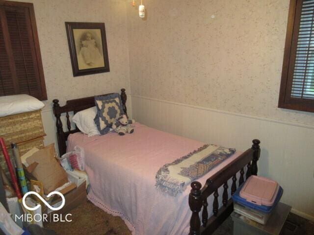 2610 Marywood Dr, Southport, IN 46227 - bedroom with wainscoting and wallpapered walls