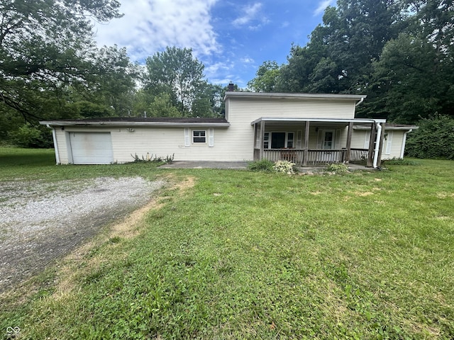 1330 Schleicher Ave, Indianapolis, IN 46229 - view of front of property with dirt driveway, a garage, a chimney, and a front yard