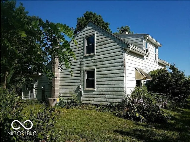 18378 Southeastern Pkwy, Fortville, IN 46040 - view of side of property with a lawn and a chimney