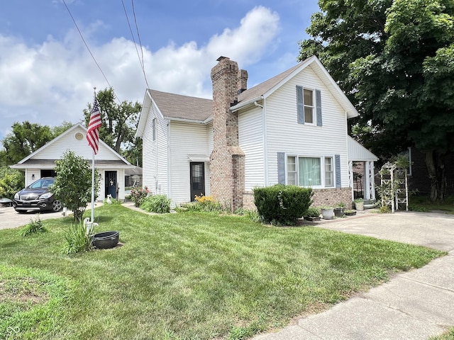 4096 N 200 W, Greenfield, IN 46140 - traditional home featuring a front yard, a chimney, and brick siding