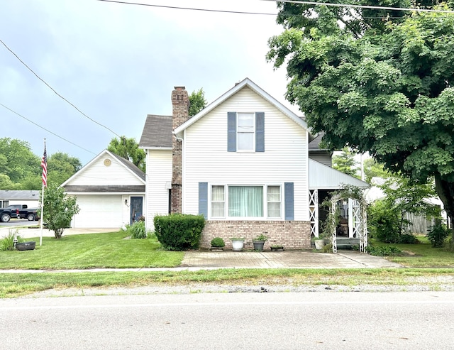 4096 N 200 W, Greenfield, IN 46140 - traditional-style house with a chimney, a detached garage, brick siding, and a front lawn
