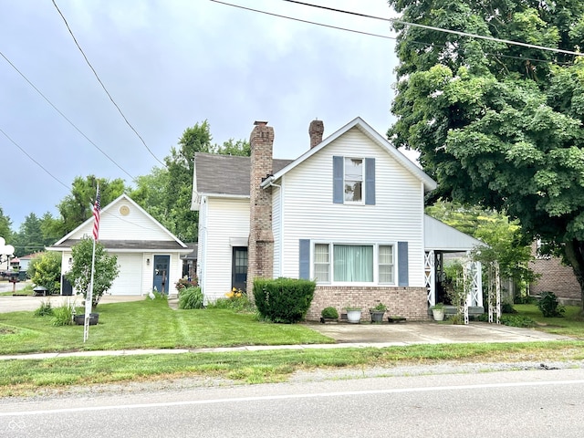 4096 N 200 W, Greenfield, IN 46140 - traditional-style house with brick siding, an outbuilding, a chimney, a front yard, and a detached garage