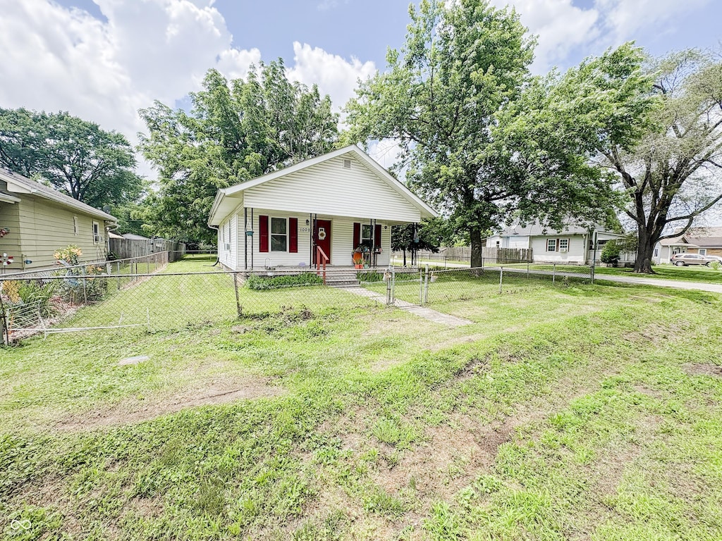 1002 S Fleming St, Indianapolis, IN 46241 - bungalow-style house with covered porch and a fenced front yard