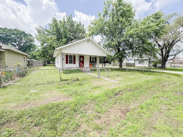1002 S Fleming St, Indianapolis, IN 46241 - bungalow-style house with covered porch and a fenced front yard