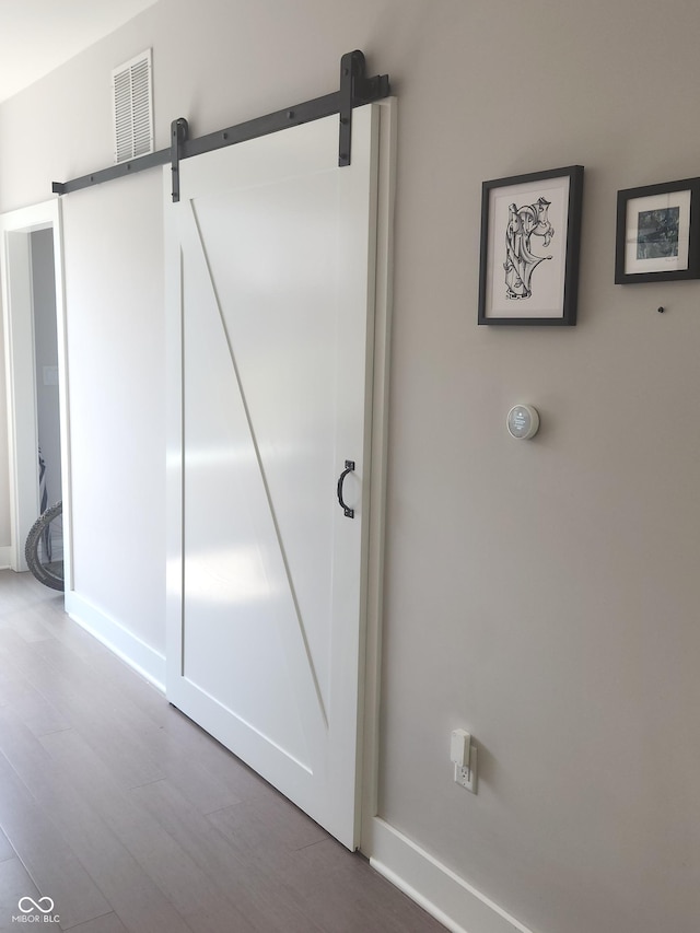 955 Dorman St, Indianapolis, IN 46202 - detailed view of a barn door and wood finished floors