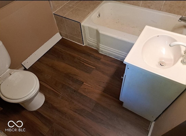 103 N Chester Ave, Indianapolis, IN 46201 - full bathroom featuring wood finished floors, vanity, and a tub to relax in