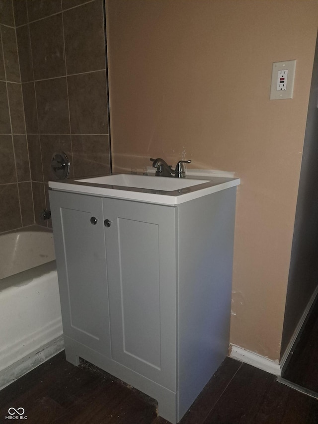 103 N Chester Ave, Indianapolis, IN 46201 - bathroom with vanity, tub / shower combination, and wood finished floors