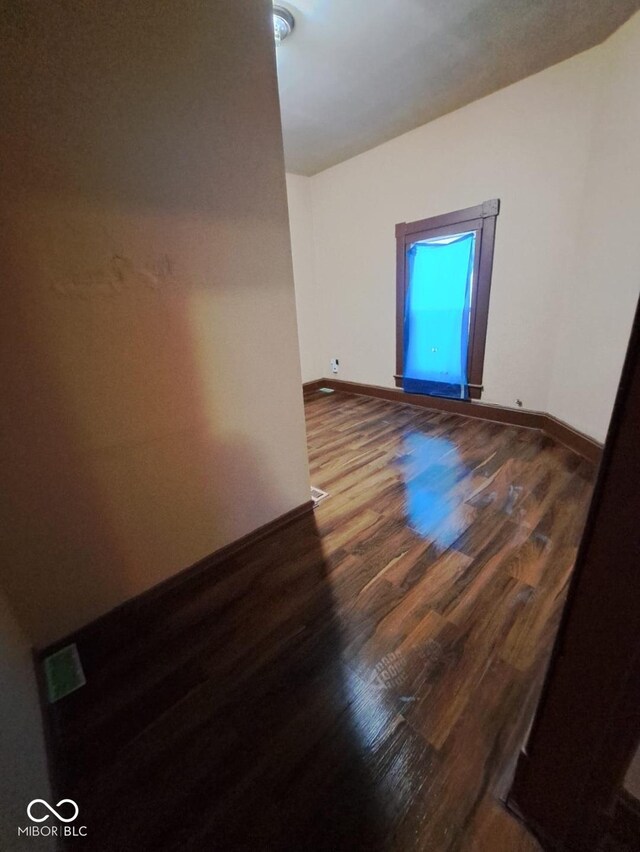 103 N Chester Ave, Indianapolis, IN 46201 - empty room featuring wood finished floors and baseboards