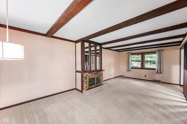 3669 Glenwood Dr, Martinsville, IN 46151 - unfurnished living room with beamed ceiling, carpet floors, and a glass covered fireplace