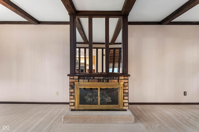 3669 Glenwood Dr, Martinsville, IN 46151 - unfurnished living room with carpet floors, beam ceiling, wooden walls, and a fireplace