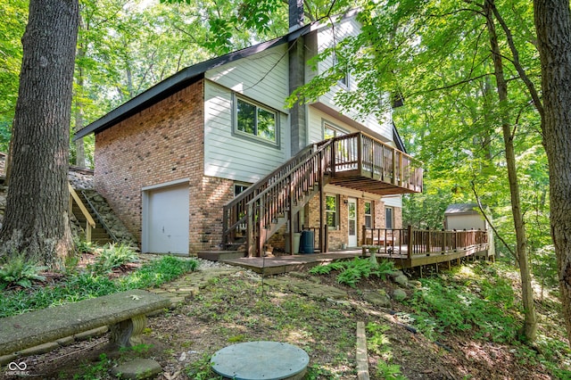 3669 Glenwood Dr, Martinsville, IN 46151 - back of house featuring brick siding, a deck, a garage, and stairs