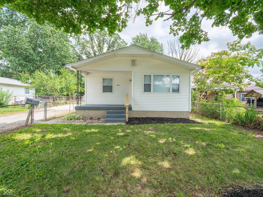 2909 S Randolph St, Indianapolis, IN 46203 - bungalow-style house with a porch, a fenced backyard, and a gate