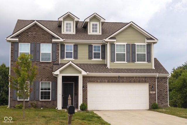 907 Ram Dr, Franklin, IN 46131 - view of front of property featuring driveway, brick siding, an attached garage, roof with shingles, and a front yard