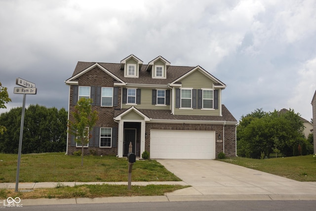 907 Ram Dr, Franklin, IN 46131 - view of front of home with a front yard, a garage, concrete driveway, brick siding, and roof with shingles