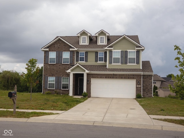 907 Ram Dr, Franklin, IN 46131 - view of front of home with an attached garage, concrete driveway, a front lawn, brick siding, and roof with shingles