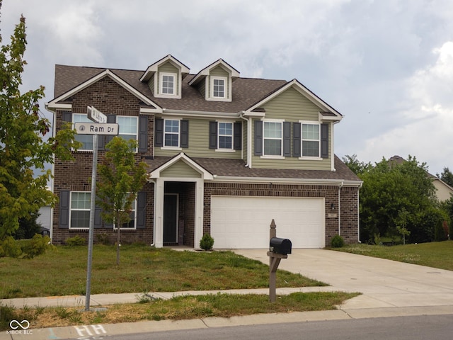 907 Ram Dr, Franklin, IN 46131 - view of front of house featuring an attached garage, driveway, brick siding, a front yard, and roof with shingles