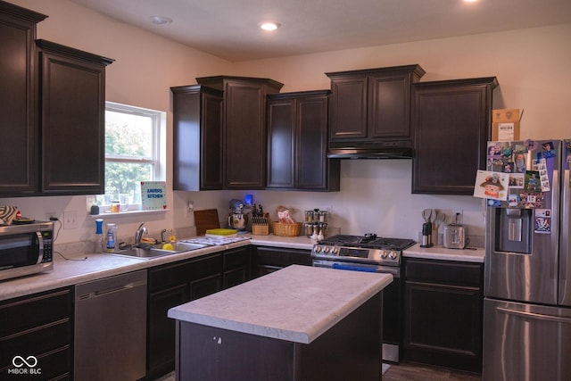 907 Ram Dr, Franklin, IN 46131 - kitchen with stainless steel appliances, under cabinet range hood, light countertops, dark brown cabinets, and a kitchen island