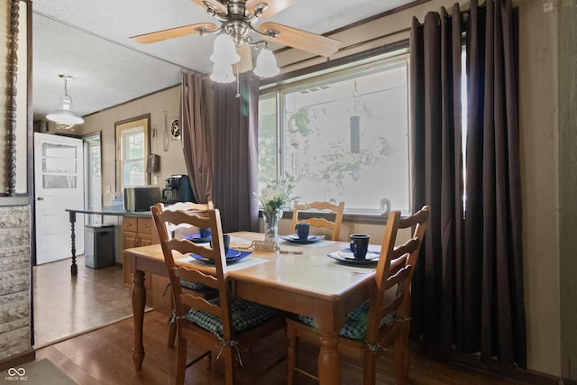 3534 Carr Ave, Indianapolis, IN 46221 - dining area with ceiling fan, a textured ceiling, wood finished floors, and crown molding