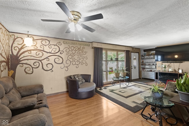 3534 Carr Ave, Indianapolis, IN 46221 - living room featuring a textured ceiling, wood finished floors, and ceiling fan