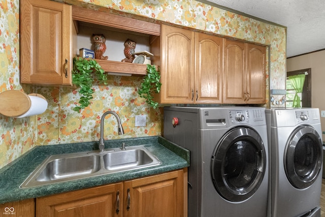 3534 Carr Ave, Indianapolis, IN 46221 - washroom featuring wallpapered walls, washing machine and clothes dryer, cabinet space, and a textured ceiling