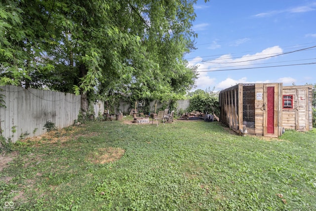 3534 Carr Ave, Indianapolis, IN 46221 - fenced backyard featuring exterior structure and an outdoor structure