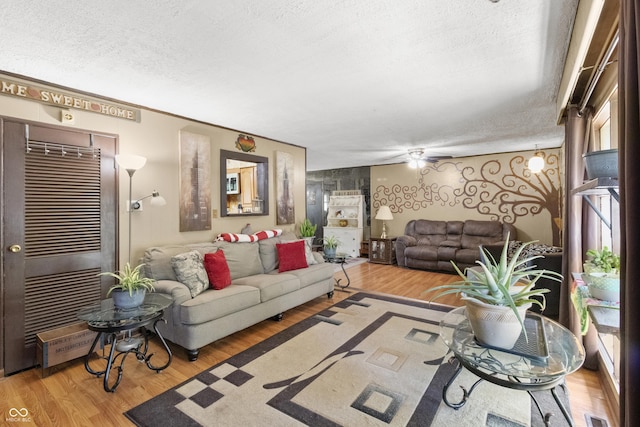 3534 Carr Ave, Indianapolis, IN 46221 - living area featuring a textured ceiling and wood finished floors