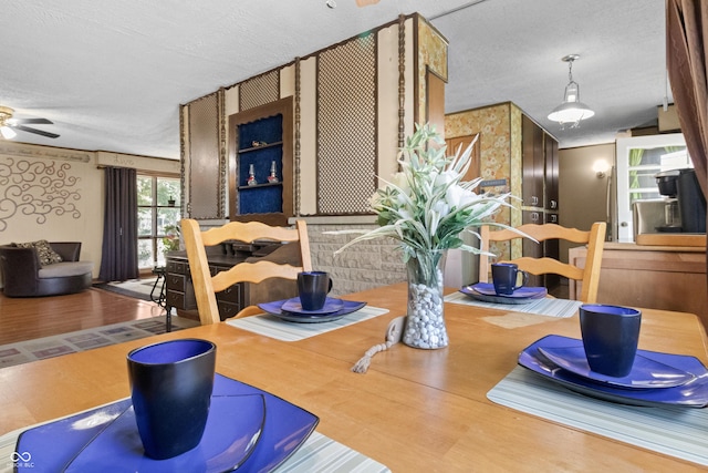 3534 Carr Ave, Indianapolis, IN 46221 - dining room featuring a textured ceiling, wood finished floors, and ceiling fan