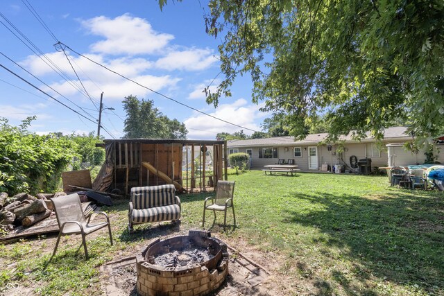 3534 Carr Ave, Indianapolis, IN 46221 - view of green lawn with a fire pit