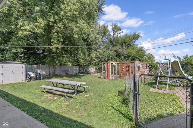 3534 Carr Ave, Indianapolis, IN 46221 - fenced backyard featuring a storage shed and a gate