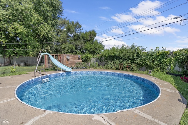 3534 Carr Ave, Indianapolis, IN 46221 - view of pool featuring a water slide and a fenced backyard
