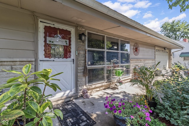 3534 Carr Ave, Indianapolis, IN 46221 - doorway to property featuring covered porch and a garage