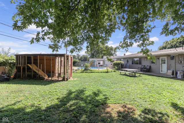 3534 Carr Ave, Indianapolis, IN 46221 - view of yard with exterior structure, an outbuilding, and a patio