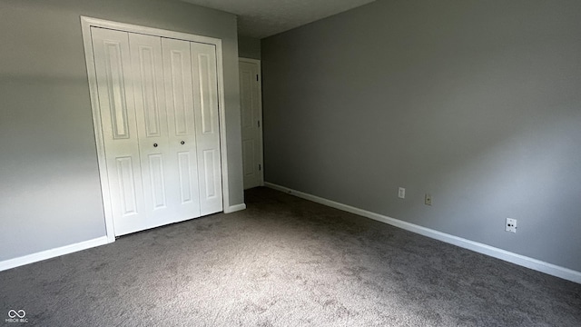 2083 Kerns Ct, Carmel, IN 46280 - unfurnished bedroom featuring dark carpet and a closet