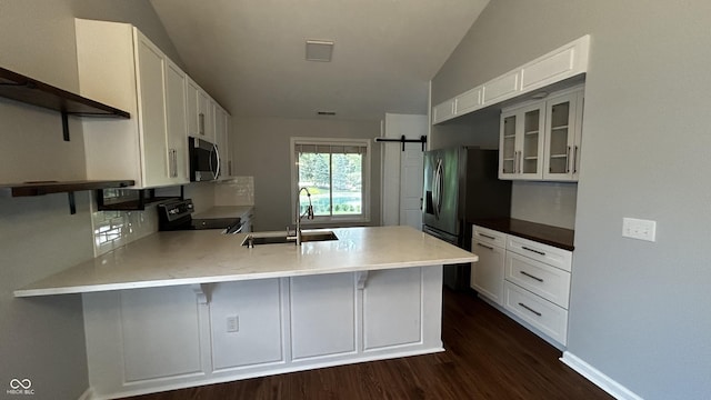 2083 Kerns Ct, Carmel, IN 46280 - kitchen featuring range with electric stovetop, a peninsula, dark wood-type flooring, lofted ceiling, and white cabinets