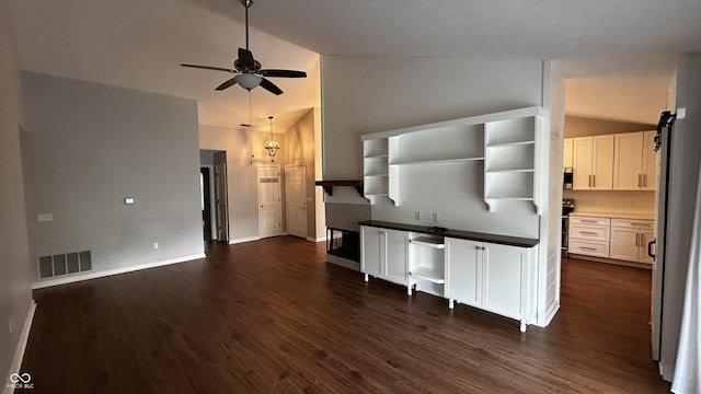 2083 Kerns Ct, Carmel, IN 46280 - unfurnished living room featuring a ceiling fan, dark wood-style floors, and high vaulted ceiling