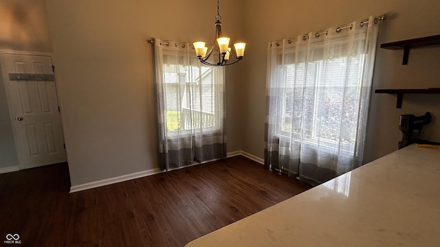 2083 Kerns Ct, Carmel, IN 46280 - unfurnished dining area with a chandelier and dark wood-style flooring