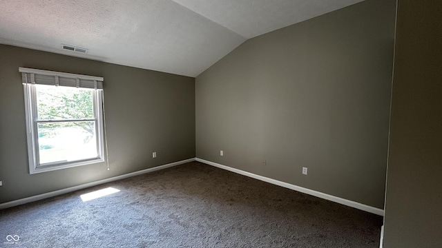 2083 Kerns Ct, Carmel, IN 46280 - spare room with carpet flooring, vaulted ceiling, and a textured ceiling