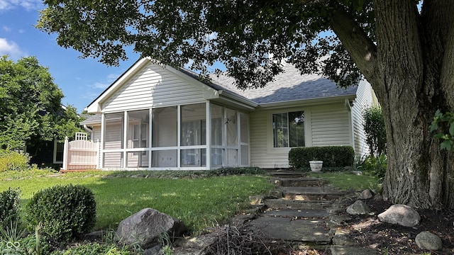 2083 Kerns Ct, Carmel, IN 46280 - view of front of house with a shingled roof, a sunroom, and a front yard