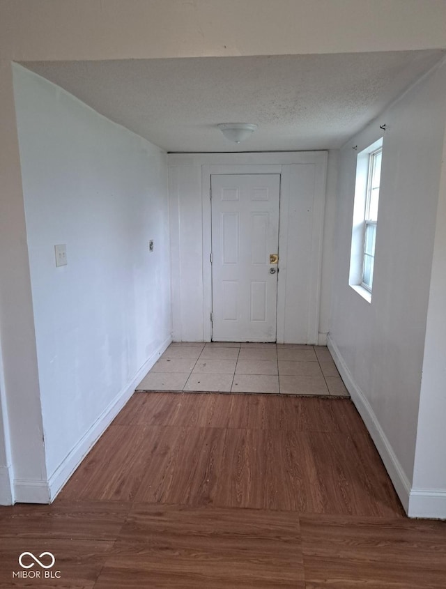 2249 E Brookside Ave, Indianapolis, IN 46218 - corridor featuring light wood finished floors and baseboards