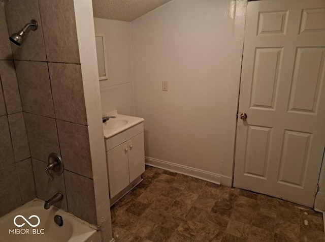 2249 E Brookside Ave, Indianapolis, IN 46218 - bathroom featuring vanity, a textured ceiling, and bathtub / shower combination