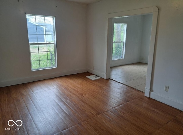 2249 E Brookside Ave, Indianapolis, IN 46218 - empty room featuring baseboards and wood finished floors