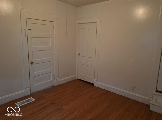 2249 E Brookside Ave, Indianapolis, IN 46218 - spare room with wood finished floors