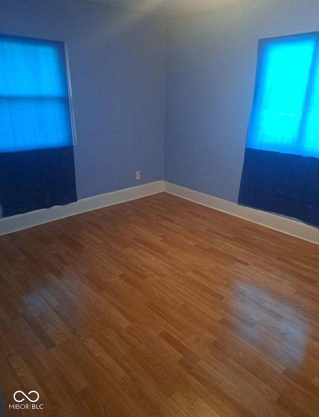 2249 E Brookside Ave, Indianapolis, IN 46218 - unfurnished room with wood finished floors and baseboards
