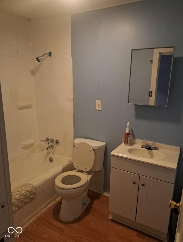 2249 E Brookside Ave, Indianapolis, IN 46218 - full bath featuring wood finished floors, vanity, and washtub / shower combination