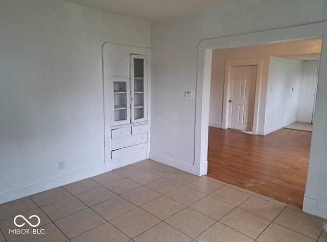 2249 E Brookside Ave, Indianapolis, IN 46218 - unfurnished room featuring light tile patterned flooring and baseboards