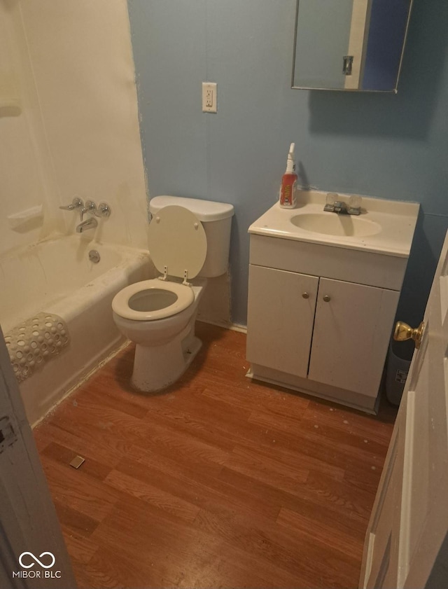 2249 E Brookside Ave, Indianapolis, IN 46218 - full bath with wood finished floors, vanity, and shower / washtub combination