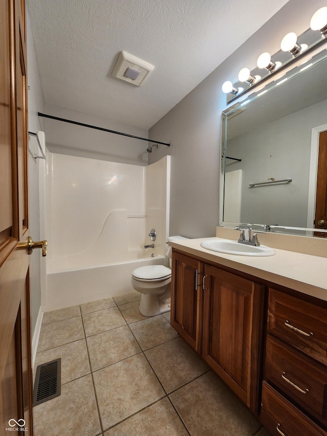 1633 Belfield St, Indianapolis, IN 46217 - full bathroom featuring shower / bathtub combination, vanity, tile patterned flooring, and a textured ceiling