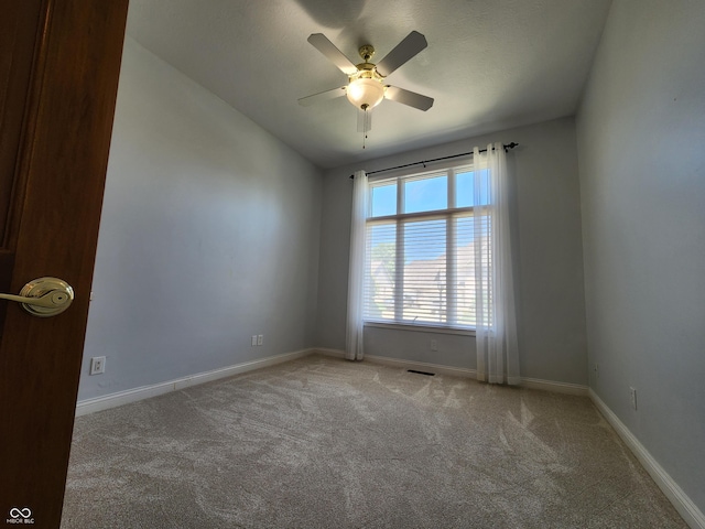 1633 Belfield St, Indianapolis, IN 46217 - carpeted spare room with a ceiling fan and baseboards