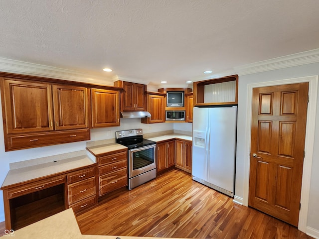 1633 Belfield St, Indianapolis, IN 46217 - kitchen featuring stainless steel appliances, under cabinet range hood, light countertops, brown cabinets, and light wood finished floors