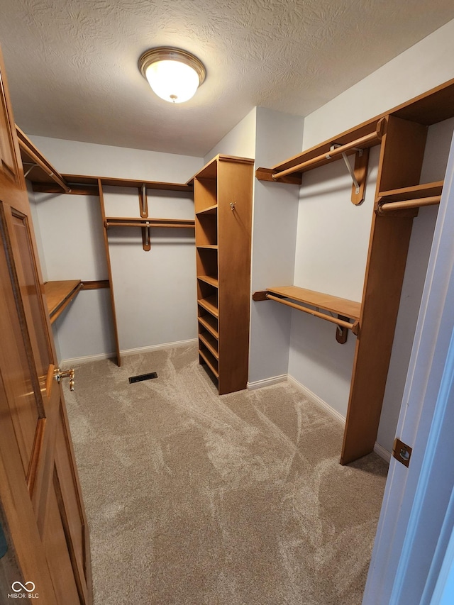 1633 Belfield St, Indianapolis, IN 46217 - spacious closet featuring carpet flooring